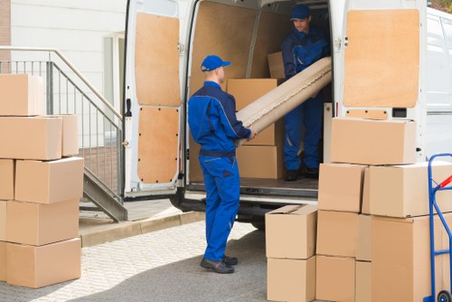 Removal team planning a move in Hounslow with boxes and furniture