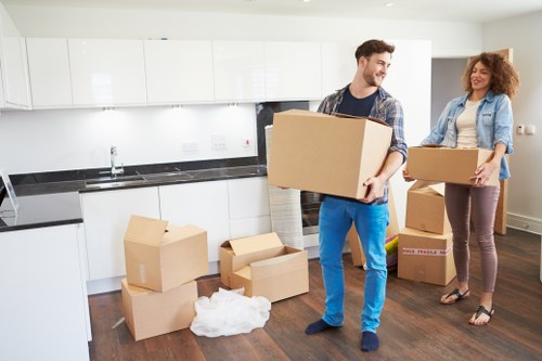 Furniture and boxes being loaded into a moving van in Hounslow