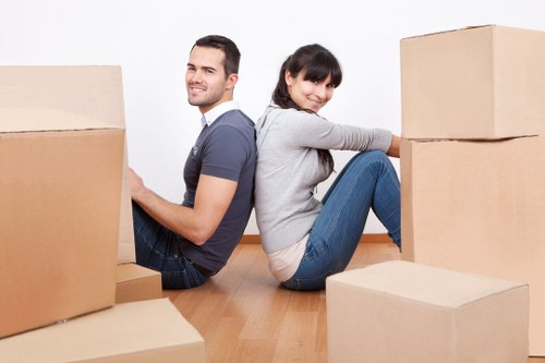 Loading furniture and boxes into a van for a Hounslow removal job