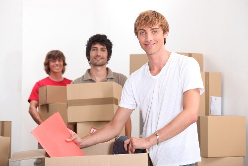 Local movers handling a flat move with careful access planning