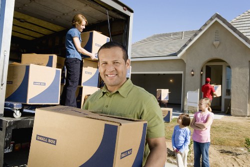 Unpacking boxes in a Hounslow home after a move